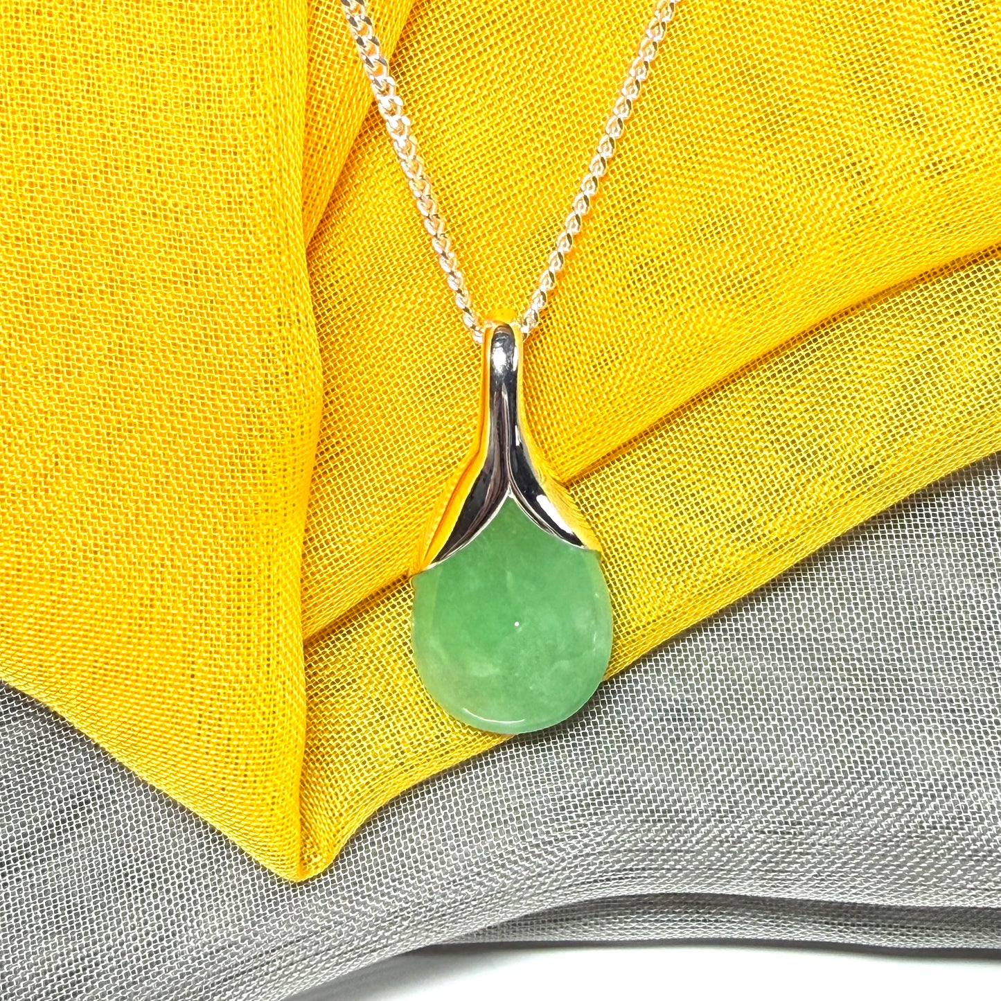 Real green jade necklace in a teardrop shaped or pear shaped, beautiful pendant