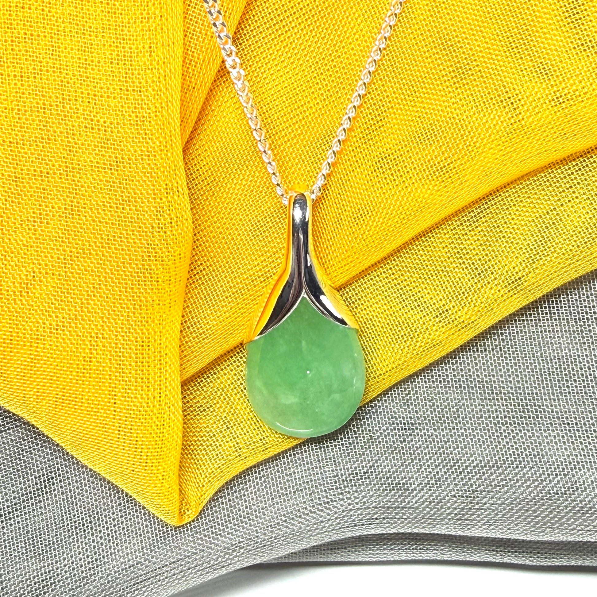 Real green jade necklace in a teardrop shaped or pear shaped, beautiful pendant