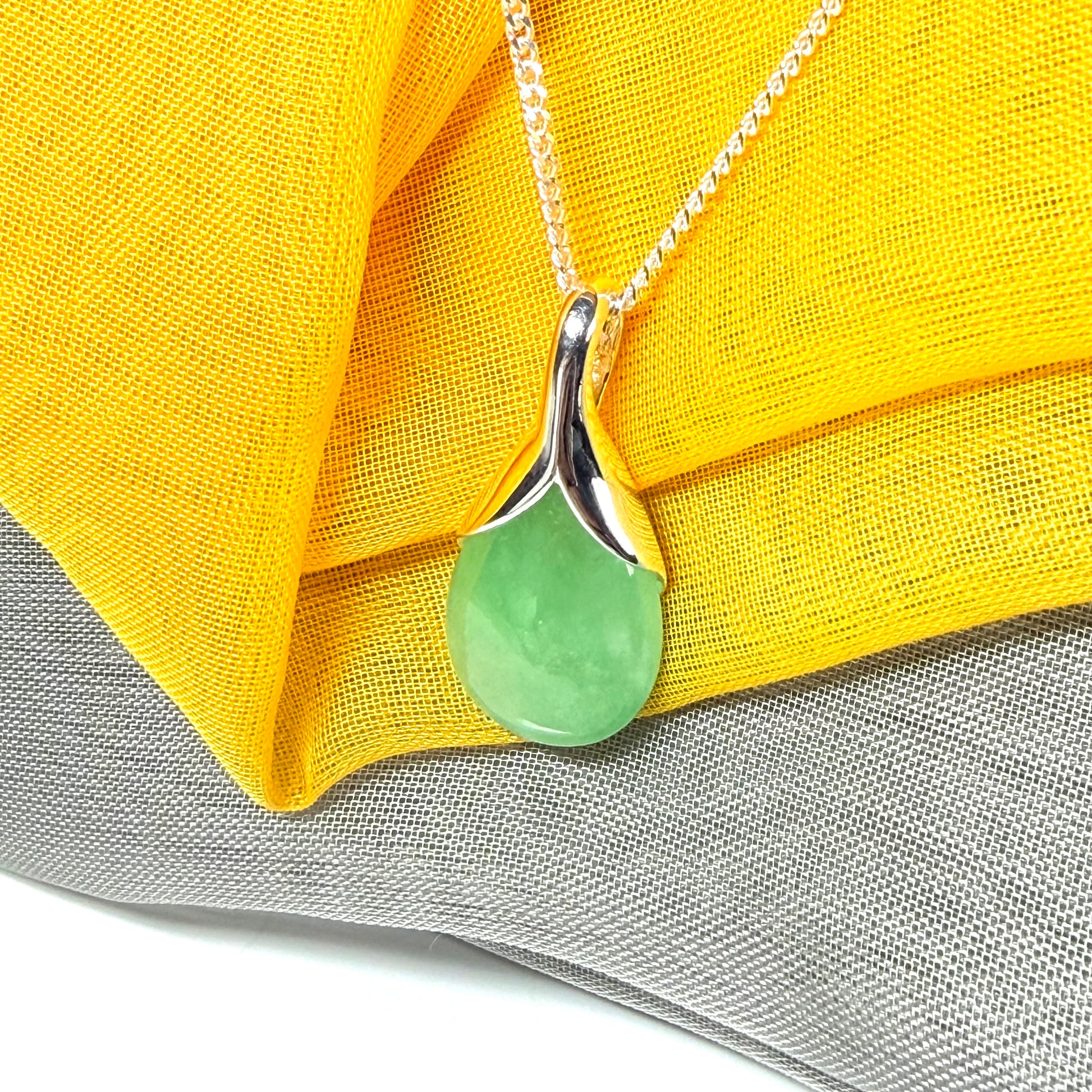 Real green jade necklace in a teardrop shaped or pear shaped, beautiful pendant