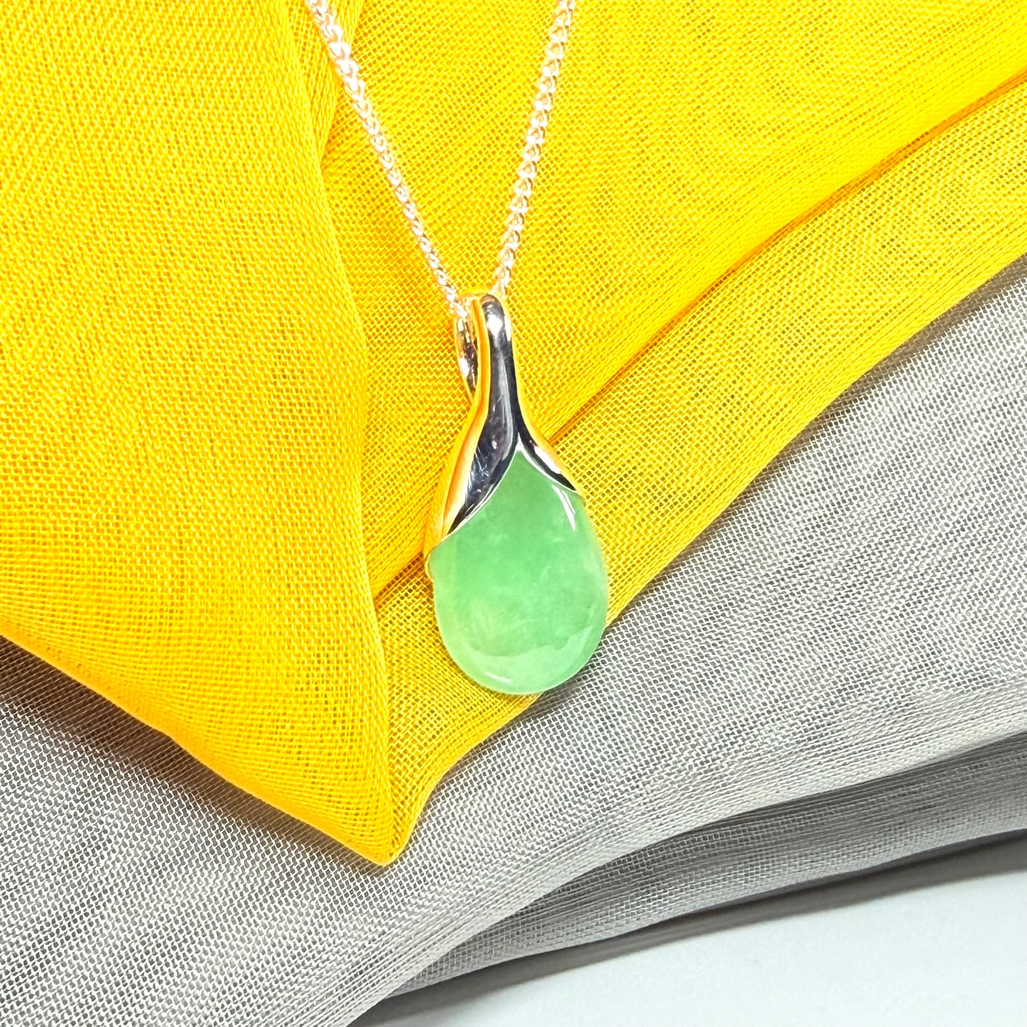 Real green jade necklace in a teardrop shaped or pear shaped, beautiful pendant