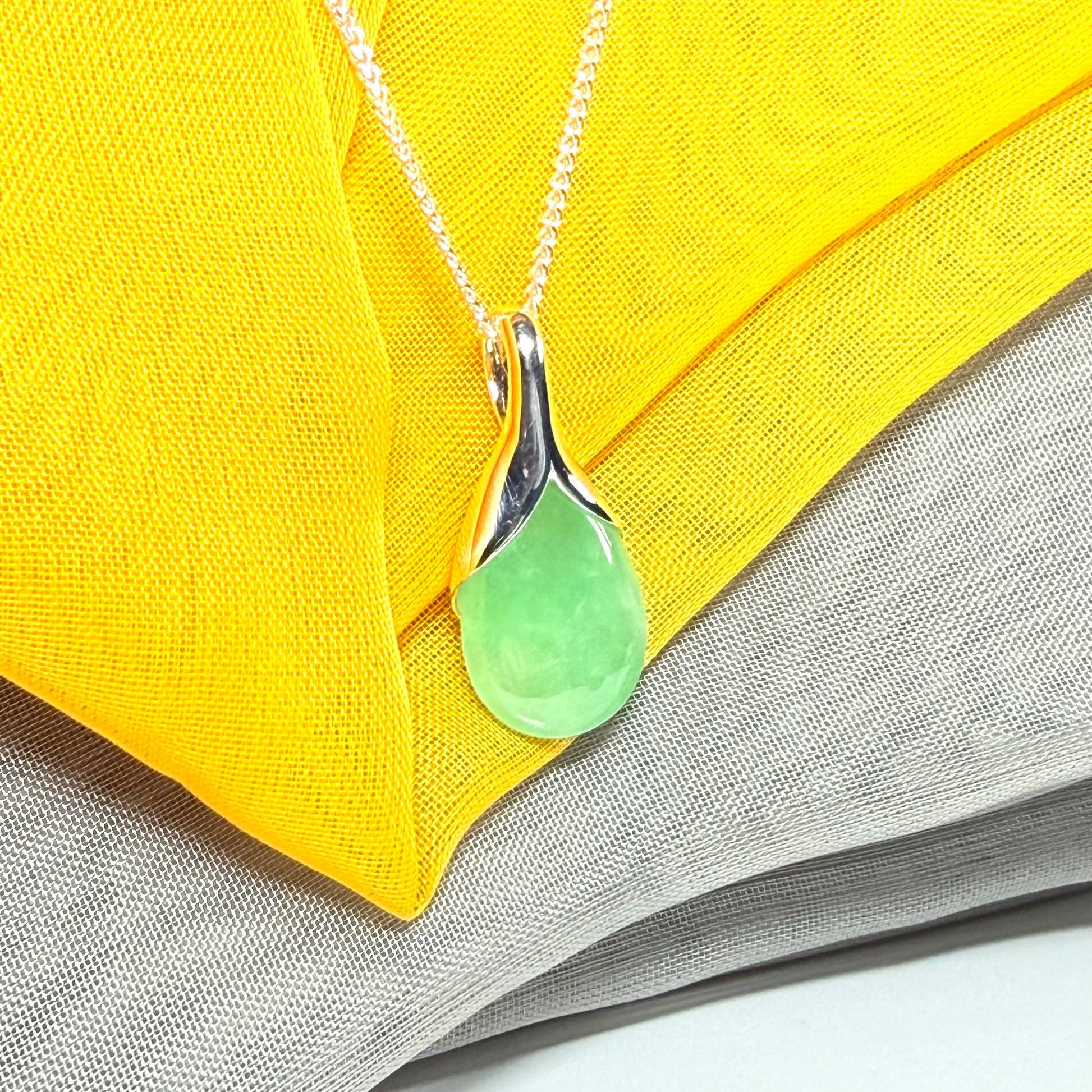 Real green jade necklace in a teardrop shaped or pear shaped, beautiful pendant