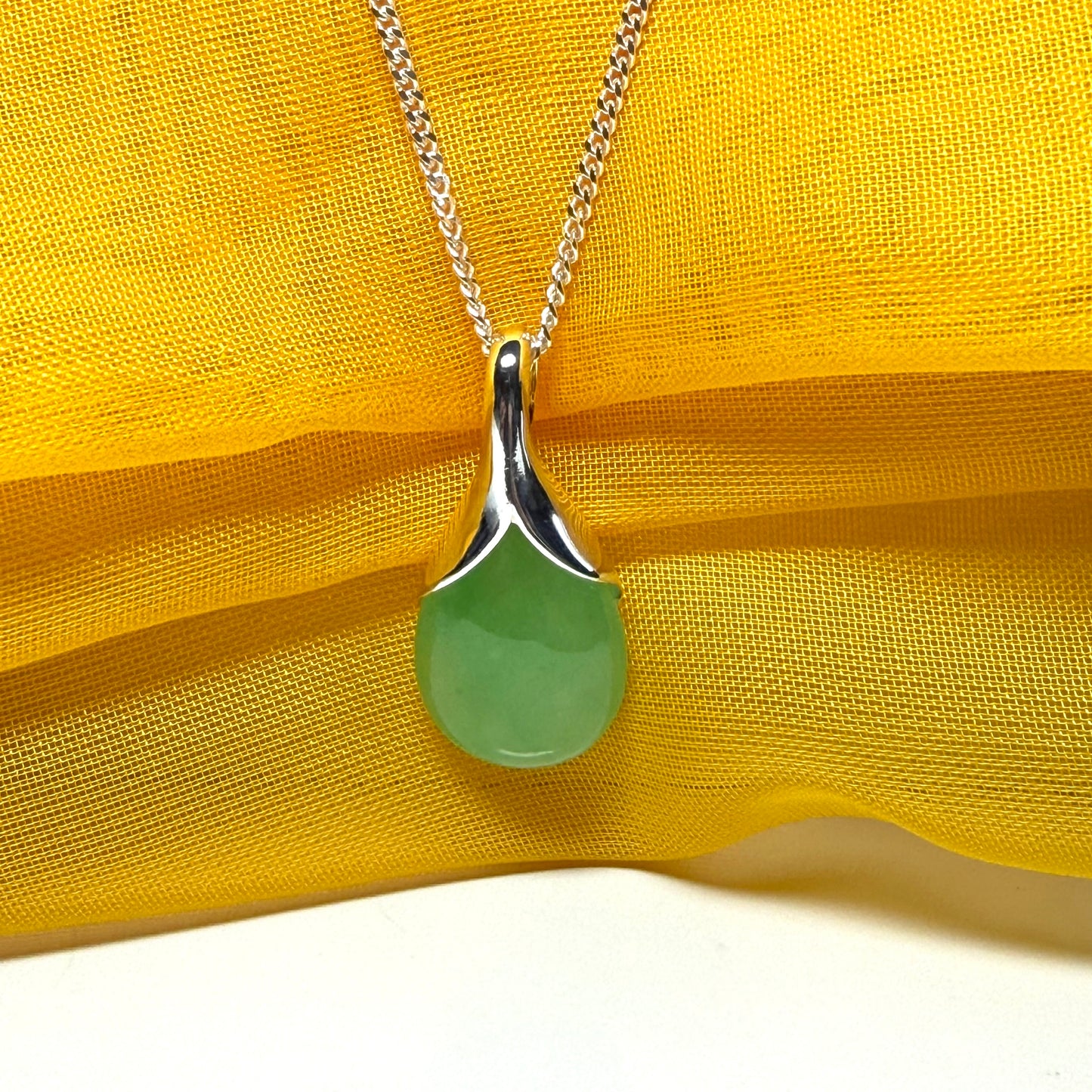 Real green jade necklace in a teardrop shaped or pear shaped, stunning pendant