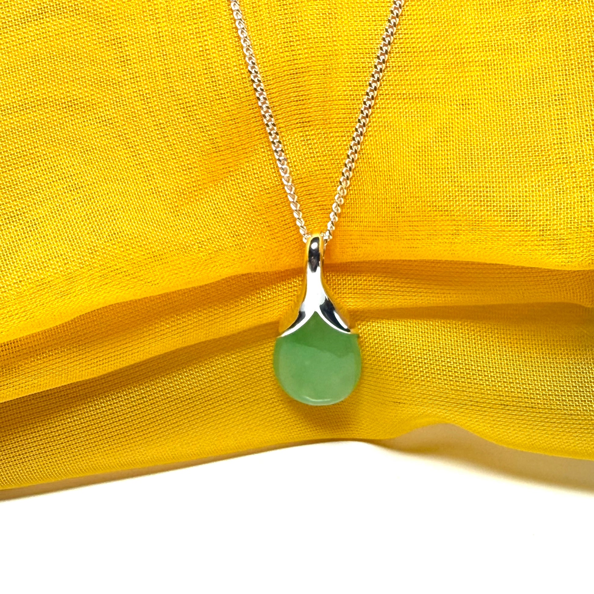 Real green jade necklace in a teardrop shaped or pear shaped, stunning pendant