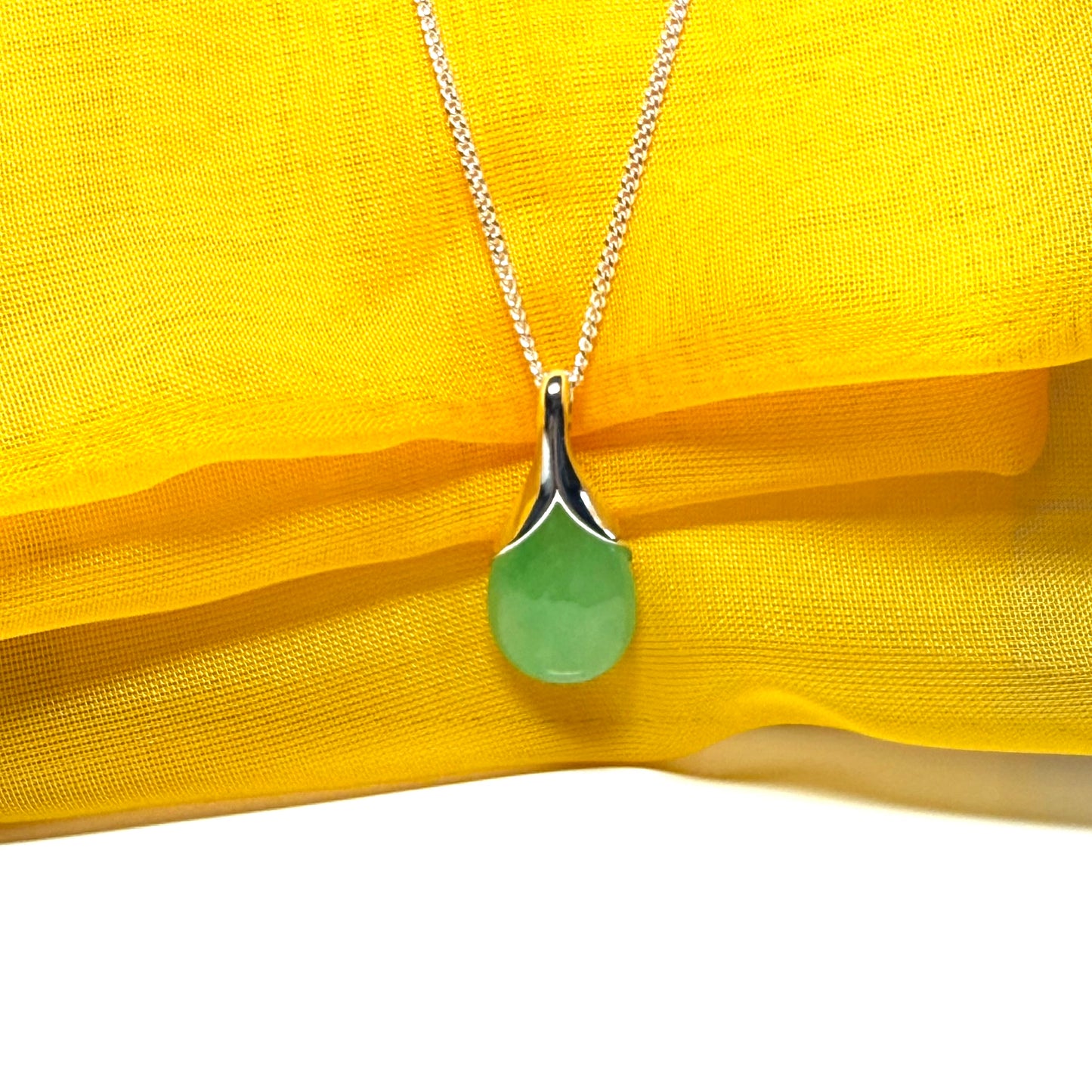 Real green jade necklace in a teardrop shaped or pear shaped, stunning pendant