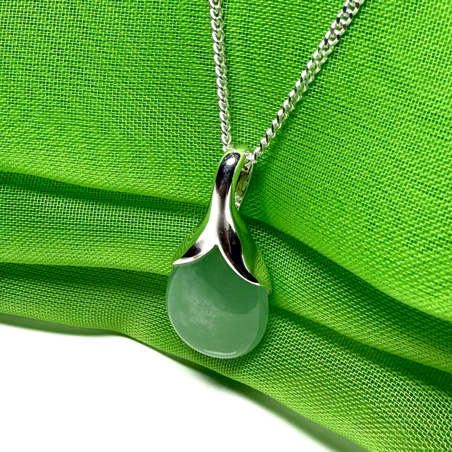 Real green jade necklace in a teardrop with pear shape, a timeless stunning designed pendant