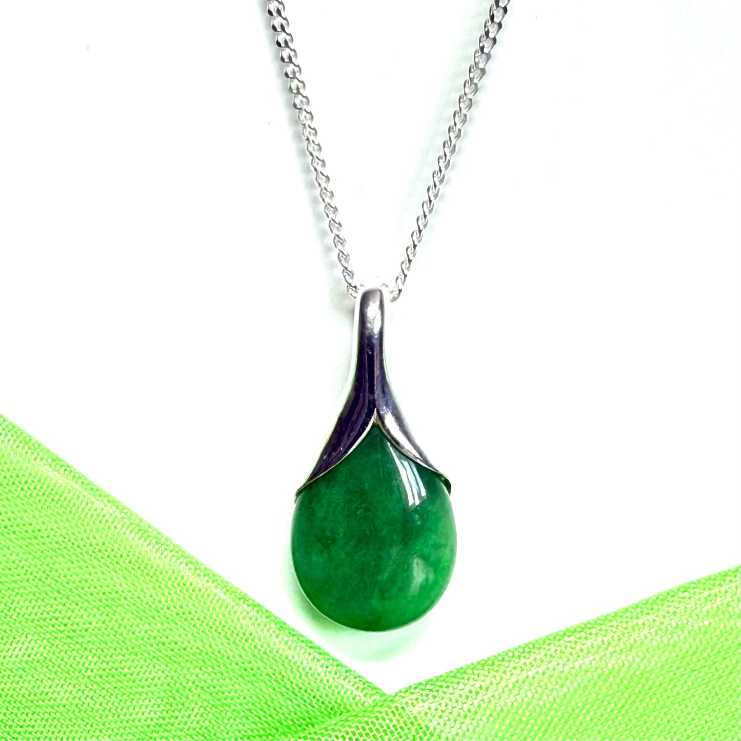 Real green jade necklace in a pear shaped sterling silver pendant