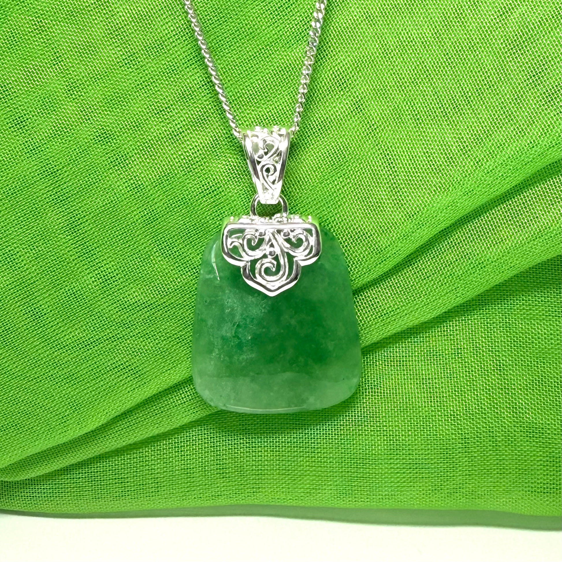 Real green jade necklace large cushion shaped including a solid silver curb chain included sterling silver