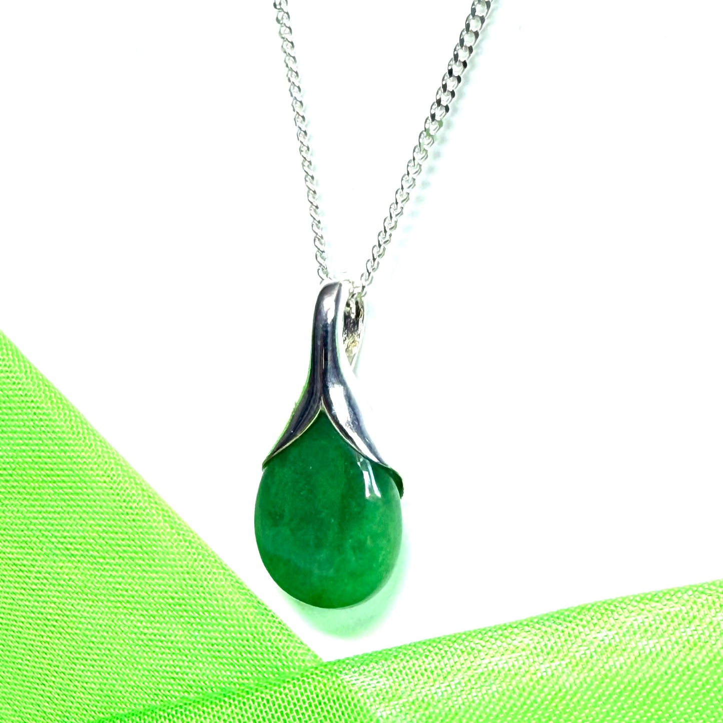 Real green jade necklace in a pear shaped sterling silver pendant