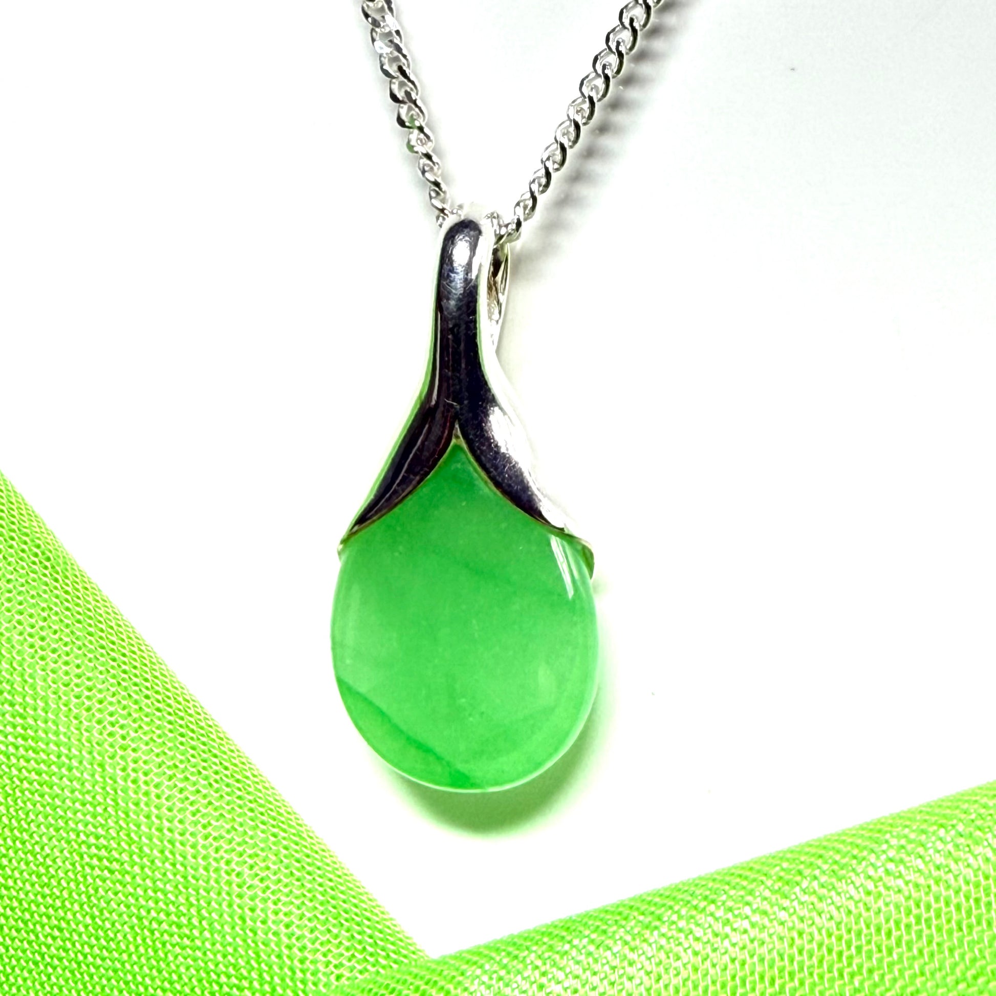 Real green jade necklace in a teardrop with pear shape, a timeless designed pendant with a chain included