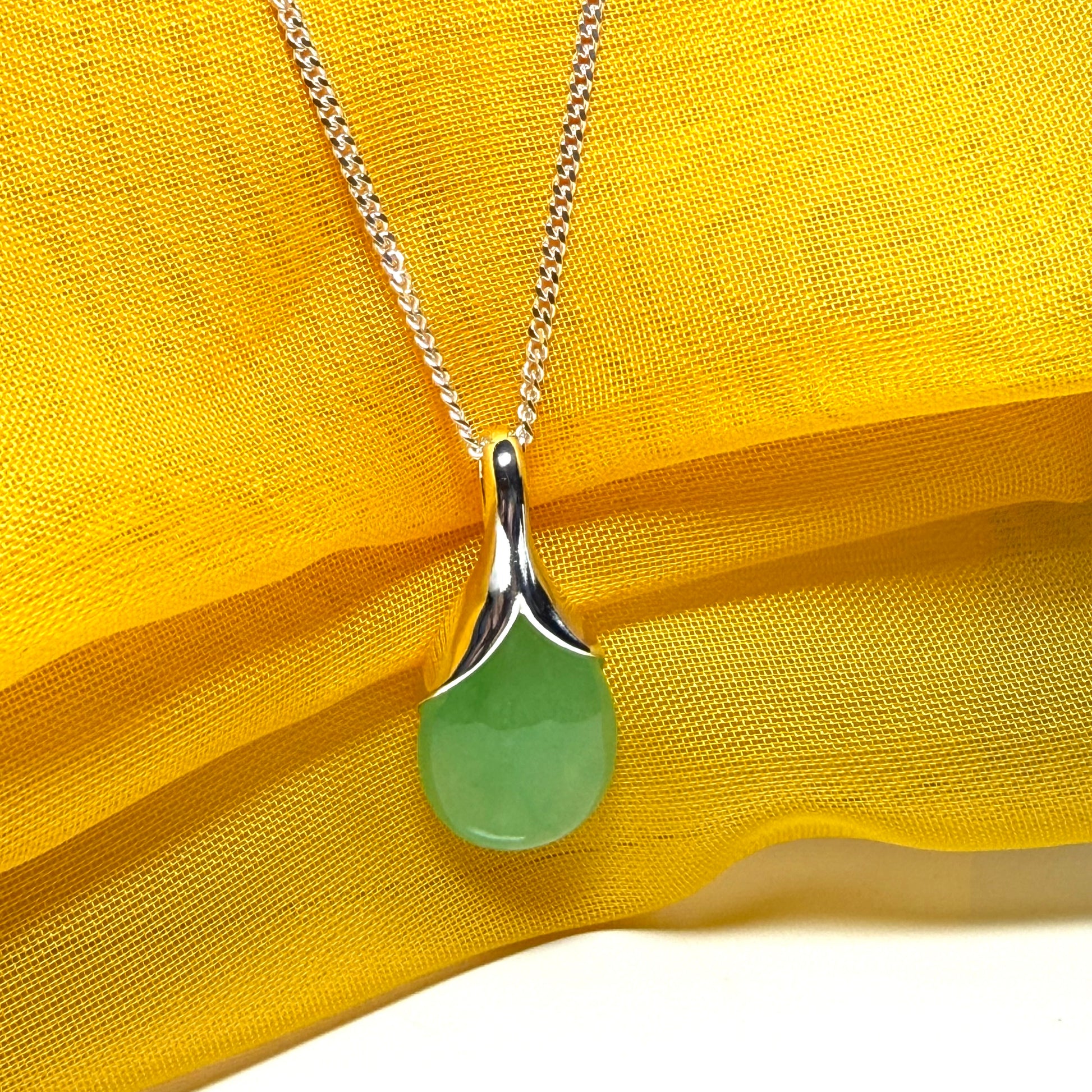 Real green jade necklace in a teardrop shaped or pear shaped, stunning pendant