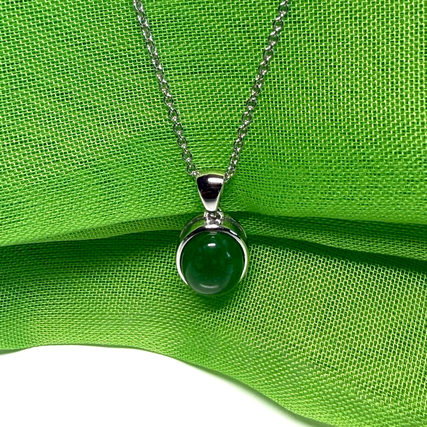 Real green jade necklace white gold oval rub over smooth setting with a chain