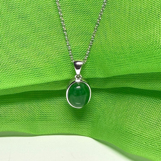 Real green jade necklace white gold oval rub over smooth setting with a chain