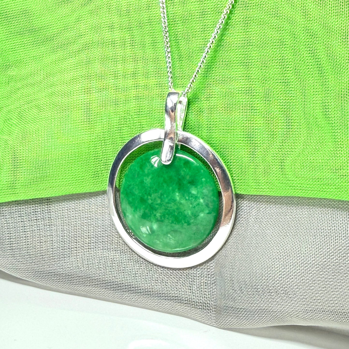 Real green jade necklace in a large round shape with a beautiful designed halo pendant with chain