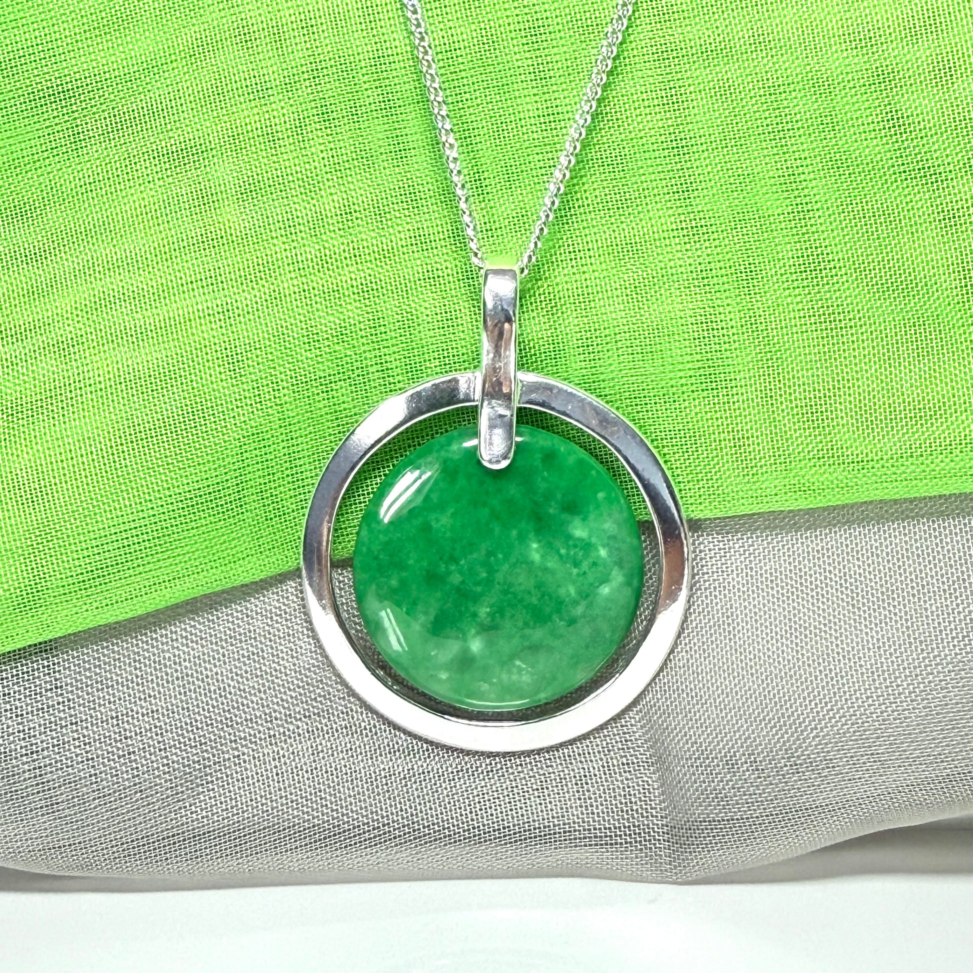 Real green jade necklace in a large round shape with a beautiful designed halo pendant with chain