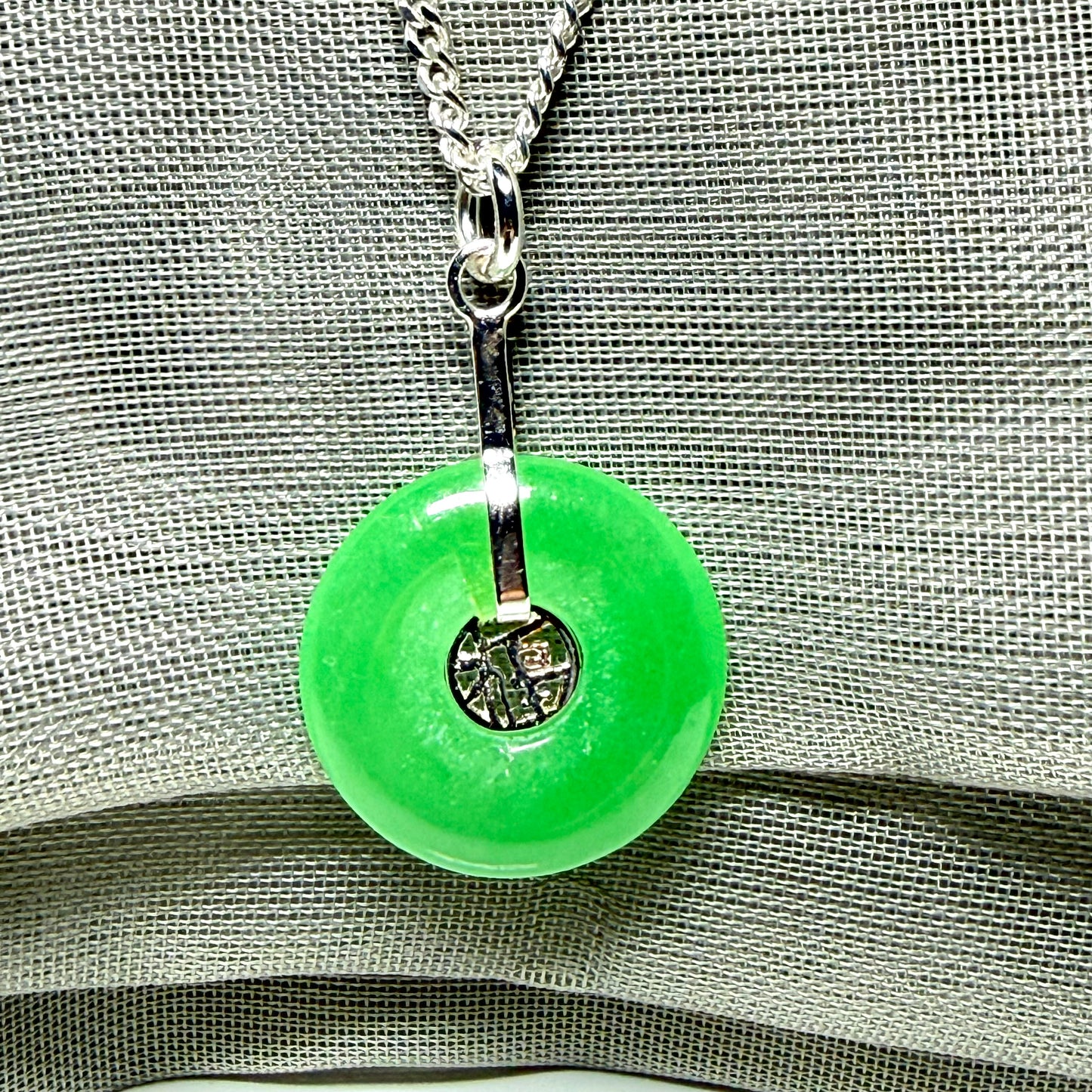 Real green jade necklace with a round pendant sterling silver and a chain
