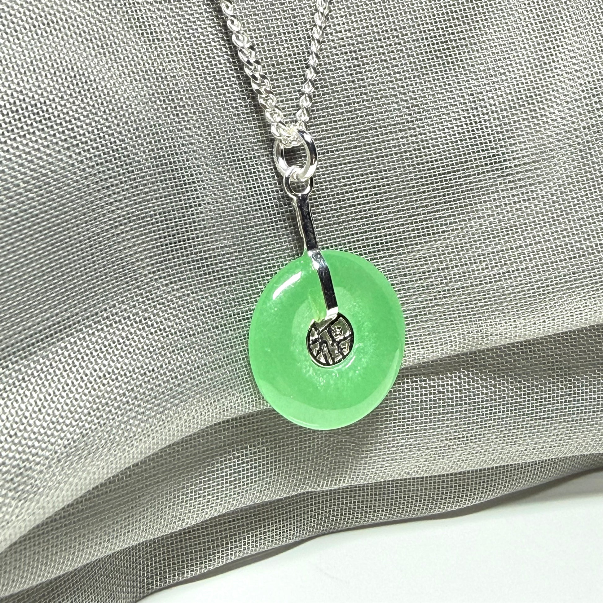 Real green jade necklace with a round pendant sterling silver and a chain