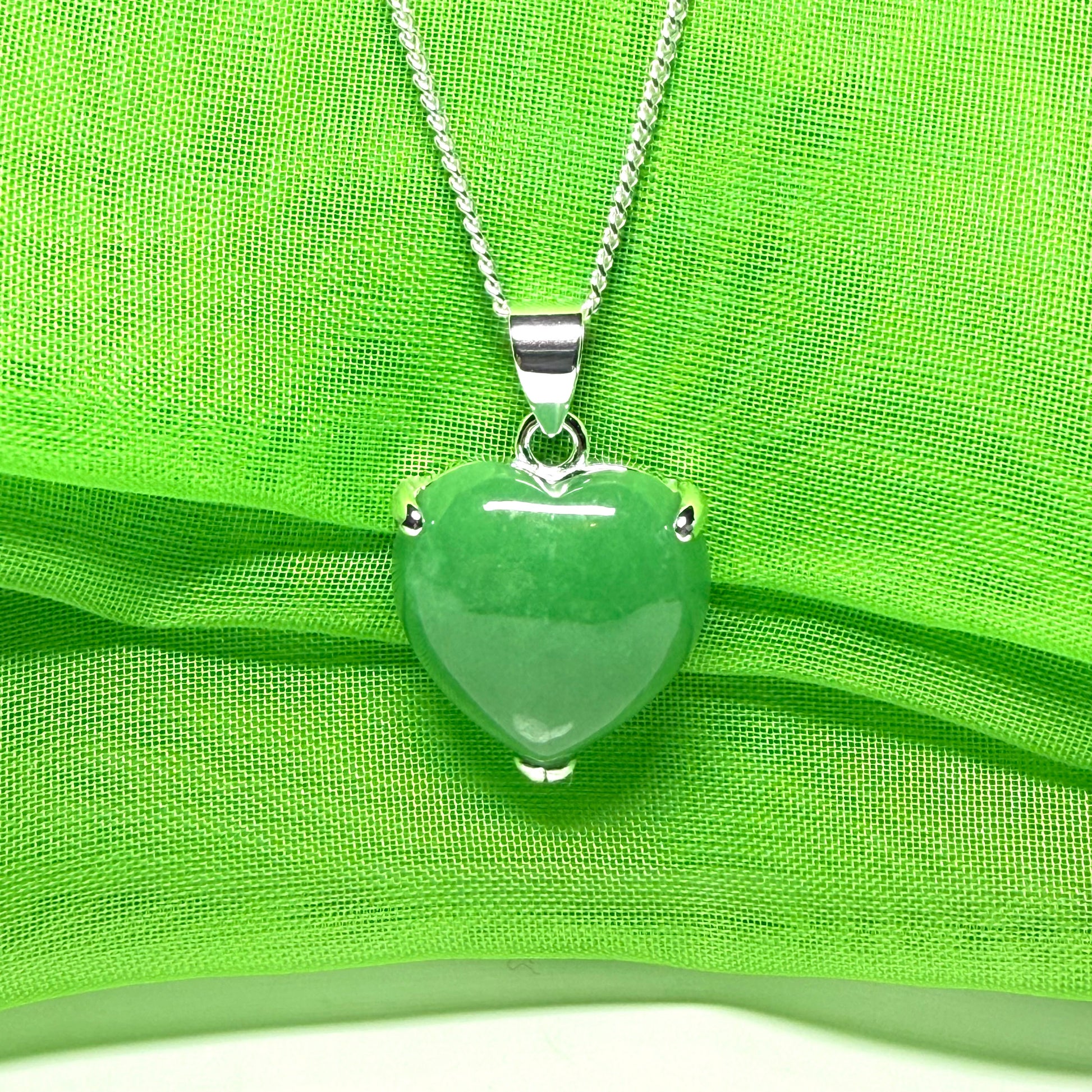 A real green jade pendant heart shaped sterling silver, a traditionally designed necklace