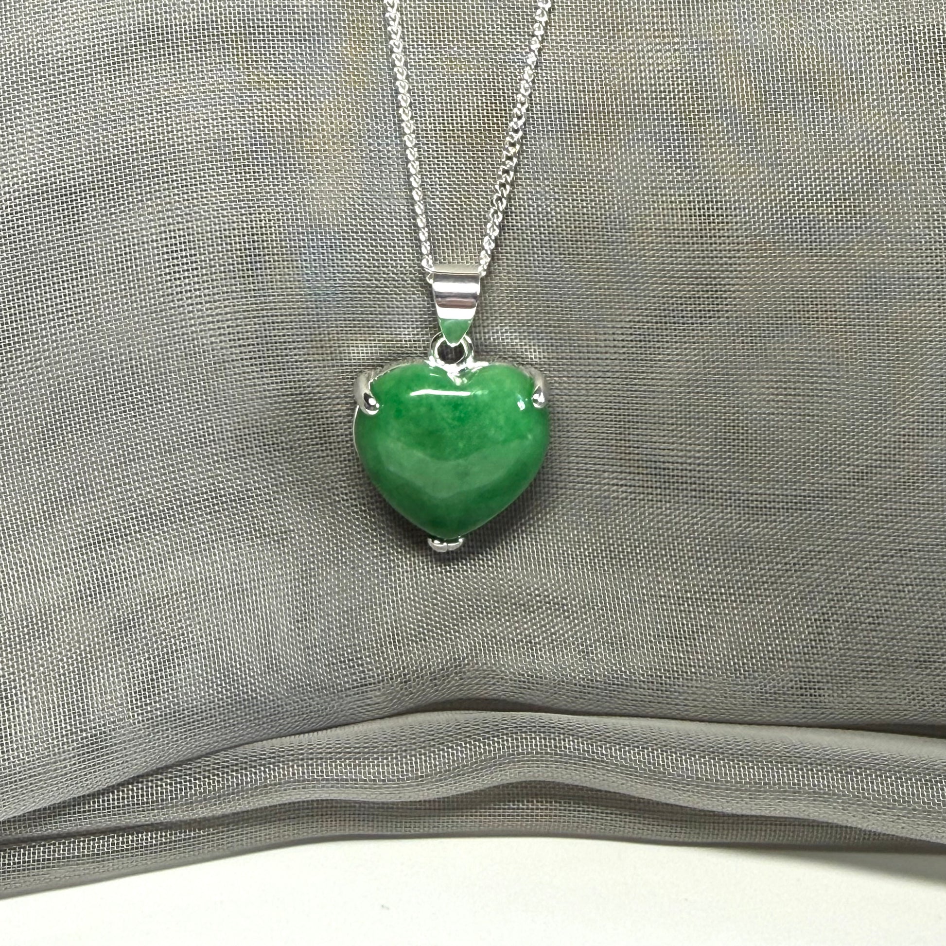 A real green jade pendant heart shaped sterling silver, a traditional designed necklace