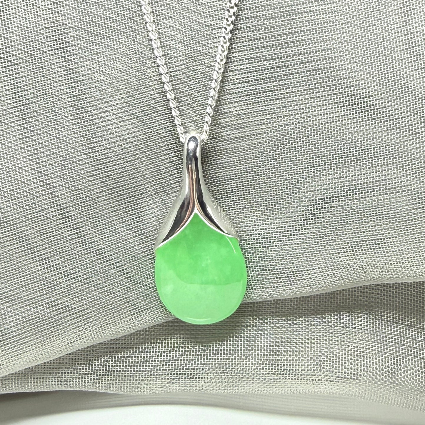 Real green jade necklace in a teardrop or pear shaped, a simply stunning pendant