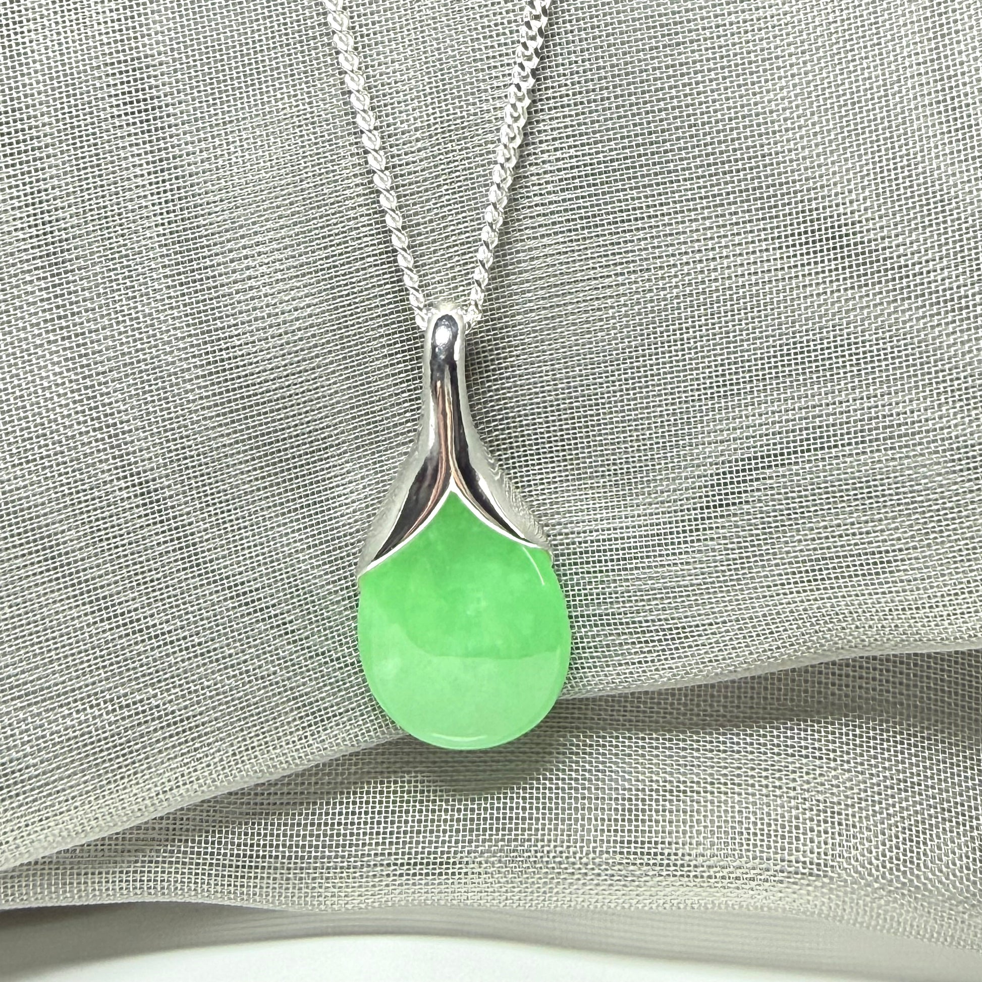 Real green jade necklace in a teardrop or pear shaped, a simply stunning pendant