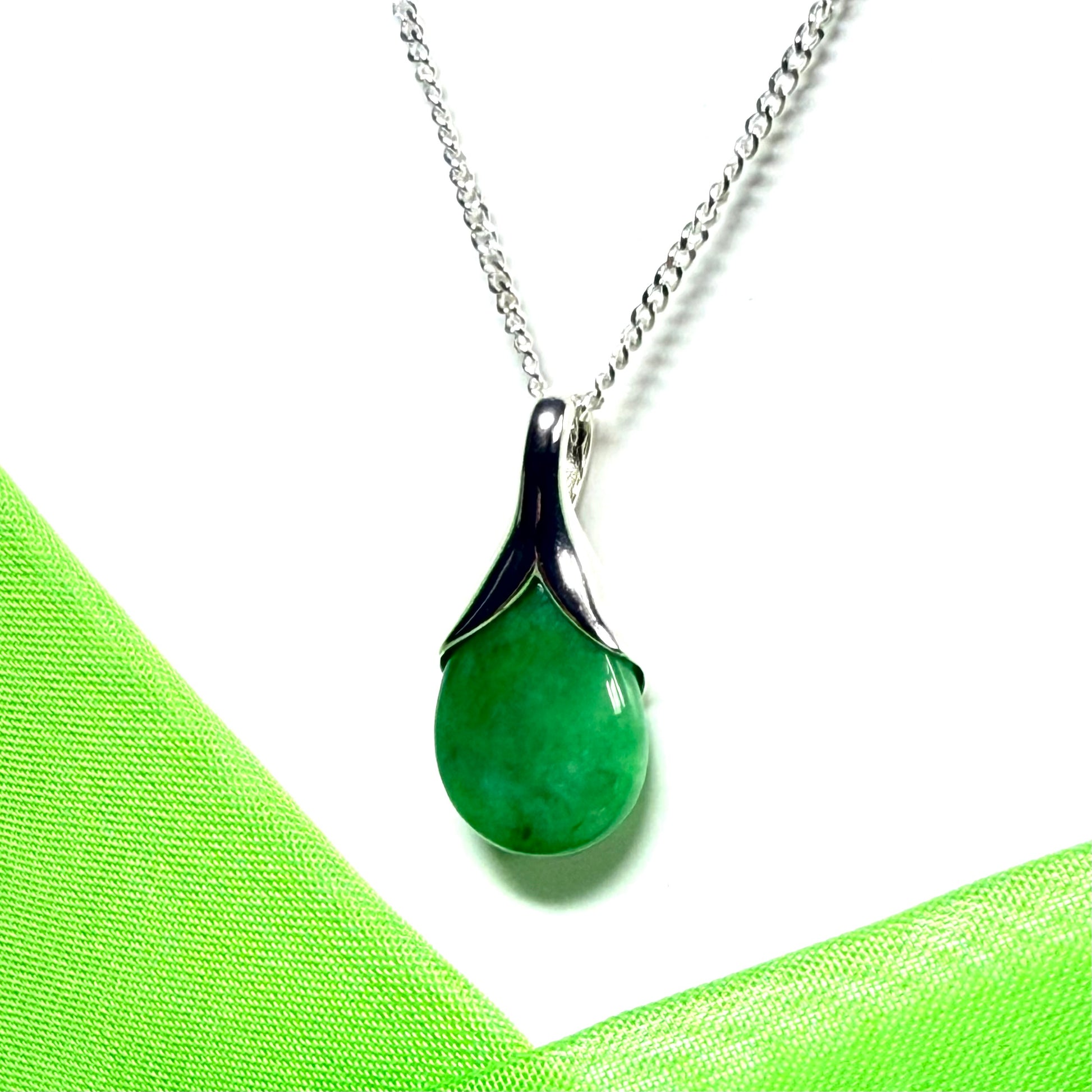 Real green jade tear drop dotted sterling silver pear shaped pendant including a solid chain