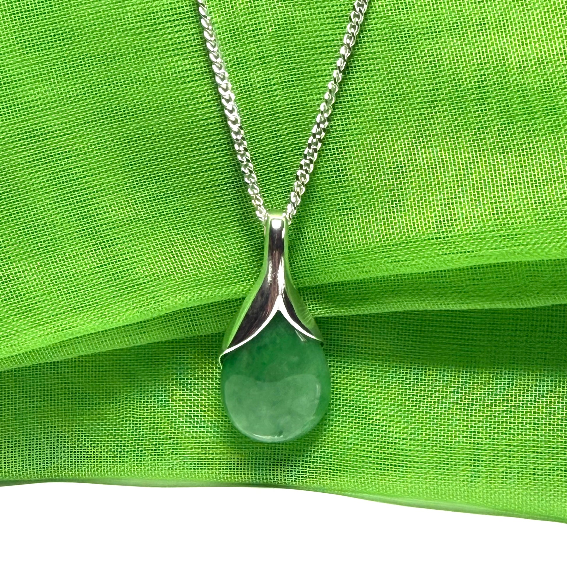 Real green jade tear drop dotted sterling silver pear shaped pendant including a solid chain