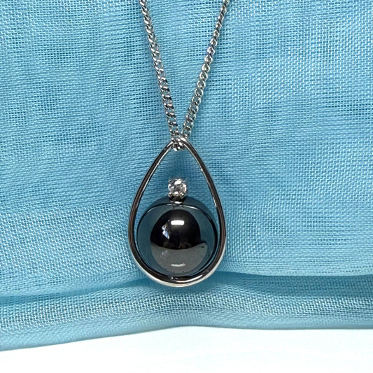 Real grey hematite necklace round inside a teardrop caged pendant