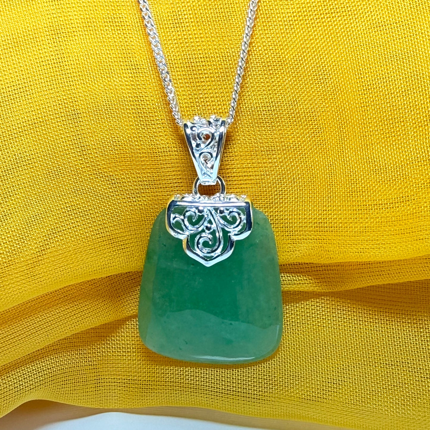 A real jade necklace green sterling silver large cushion shaped, a mesmerising designed pendant