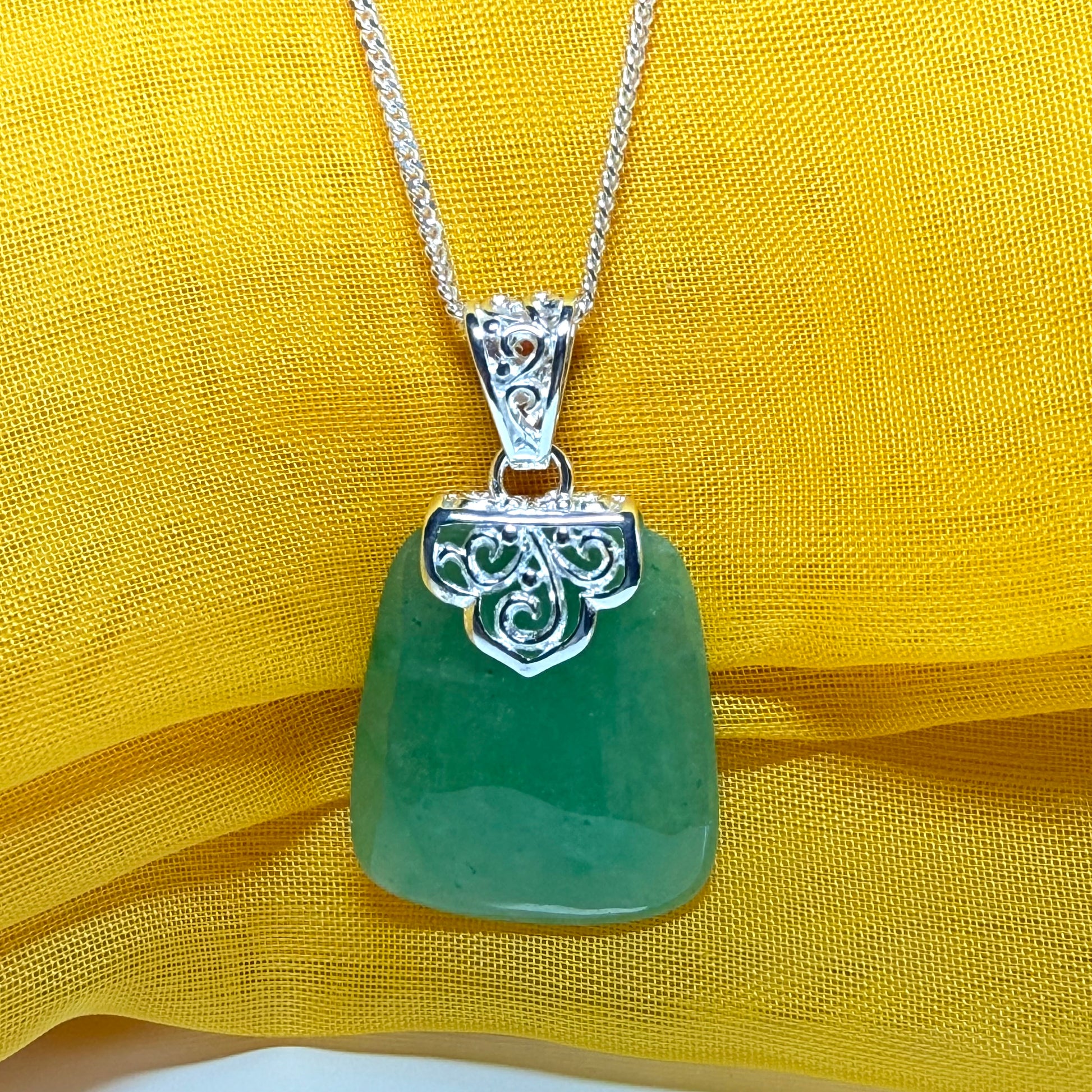 A real jade necklace green sterling silver large cushion shaped, a mesmerising designed pendant
