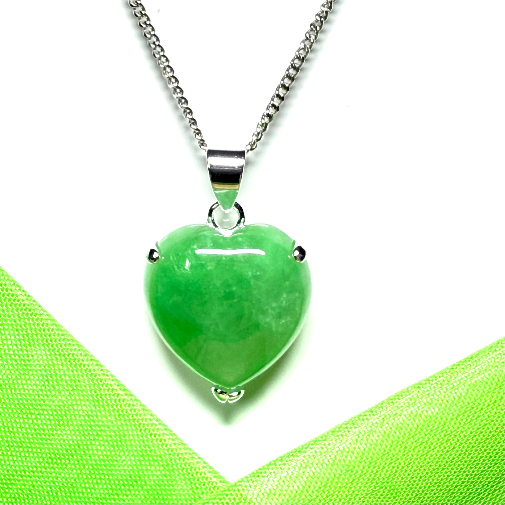 A real light green jade necklace heart shape sterling silver pendant