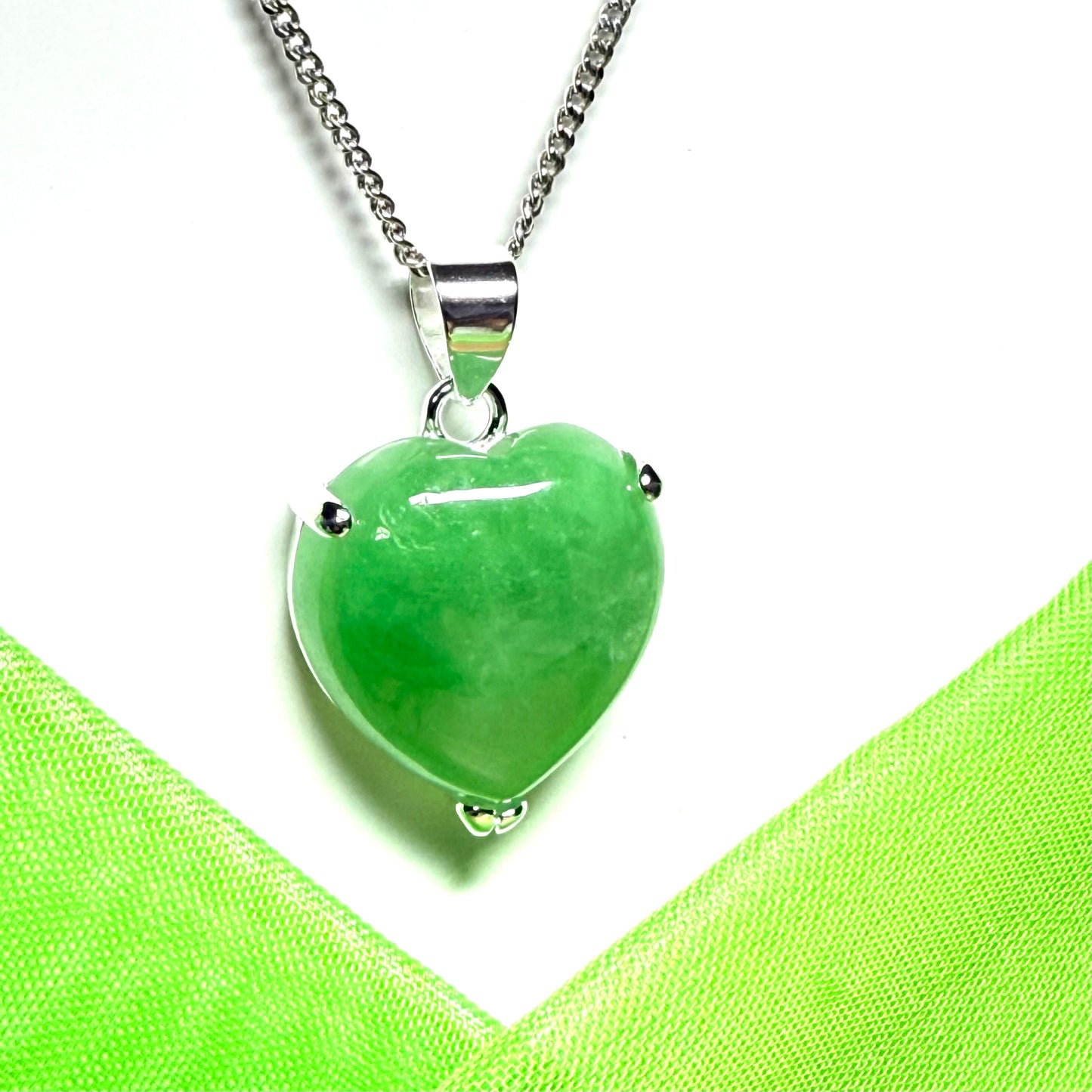A real light green jade necklace heart shape sterling silver pendant