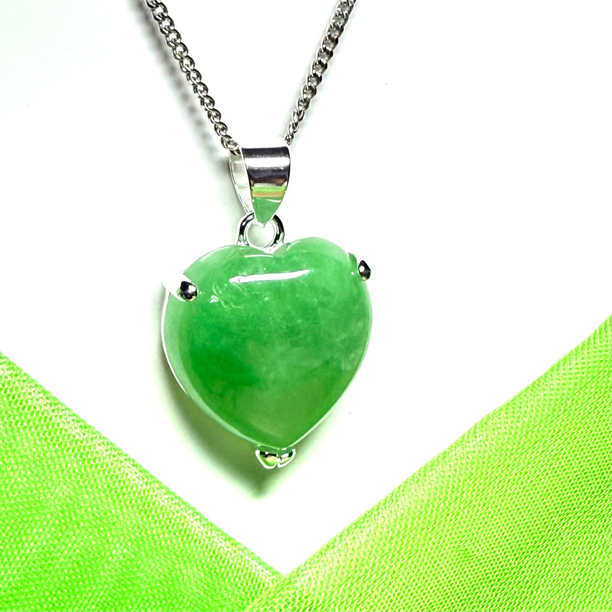 A real light green jade necklace heart shape sterling silver pendant
