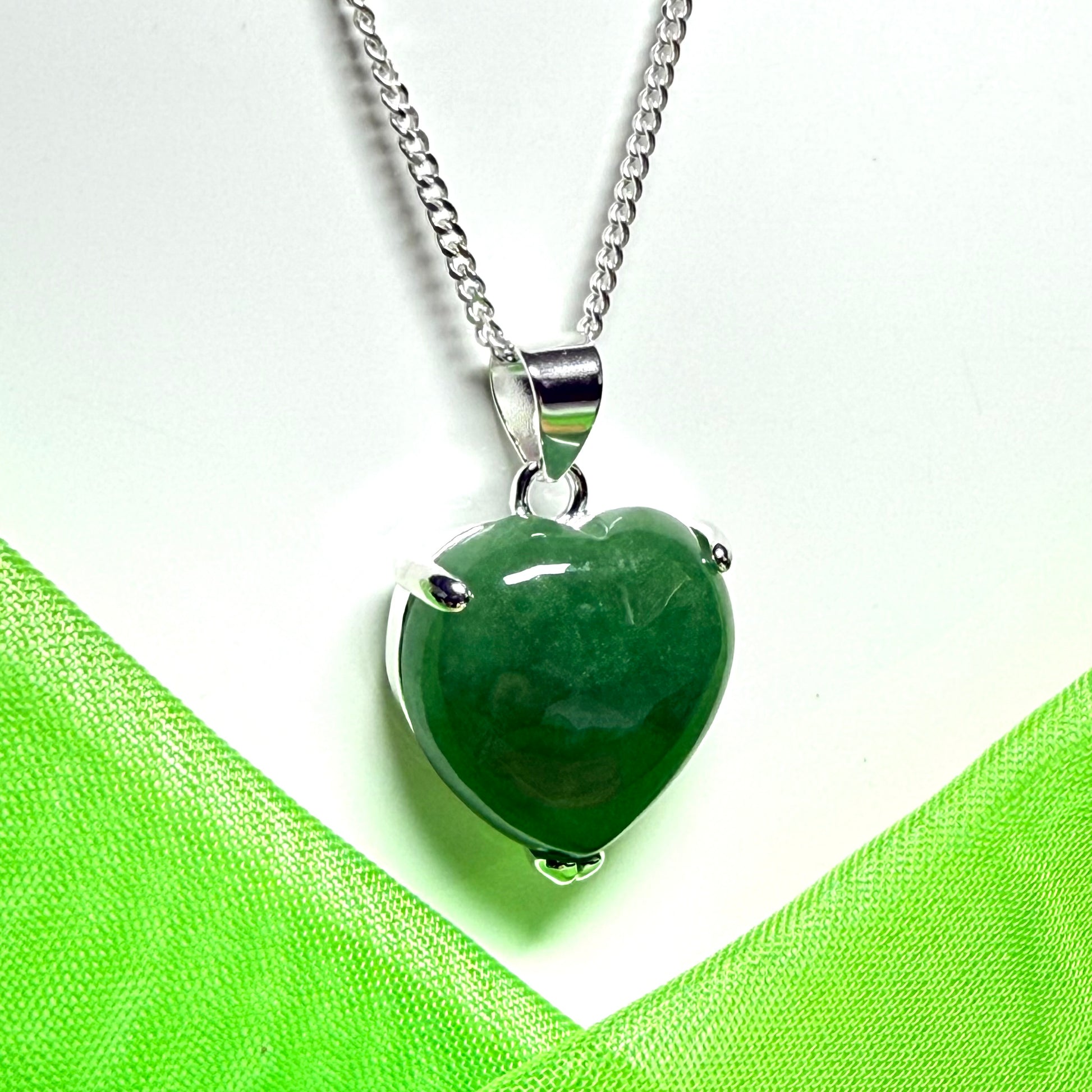 A real light green jade necklace heart shape sterling silver with solid chain