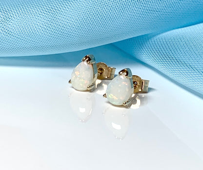 Real opal yellow gold pear shaped stud earrings