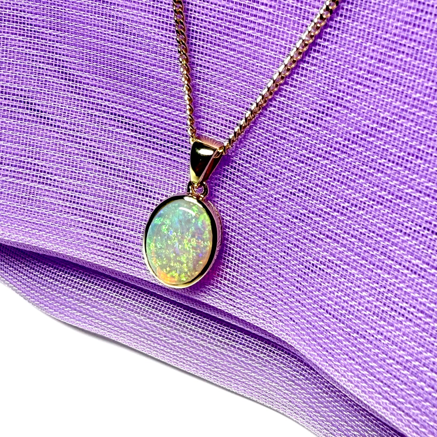 Real opal necklace yellow gold oval pendant smooth rubbed over setting