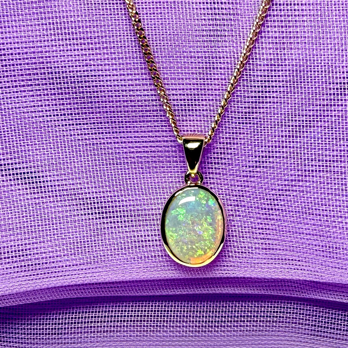 Real opal necklace yellow gold oval pendant smooth rubbed over setting