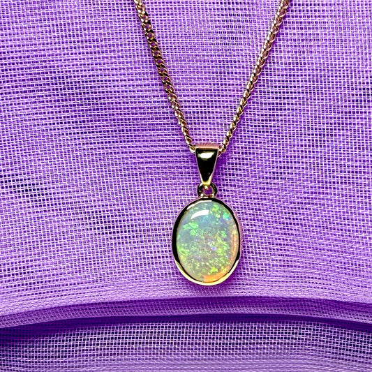 Real opal necklace yellow gold oval pendant smooth rubbed over setting