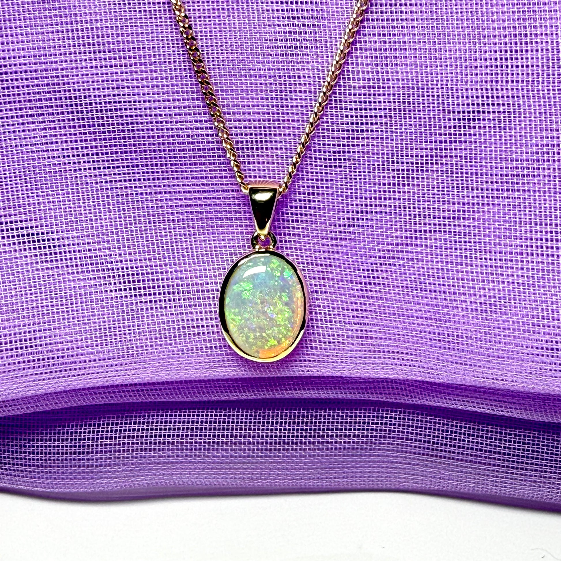 Real opal necklace yellow gold oval pendant smooth rubbed over setting