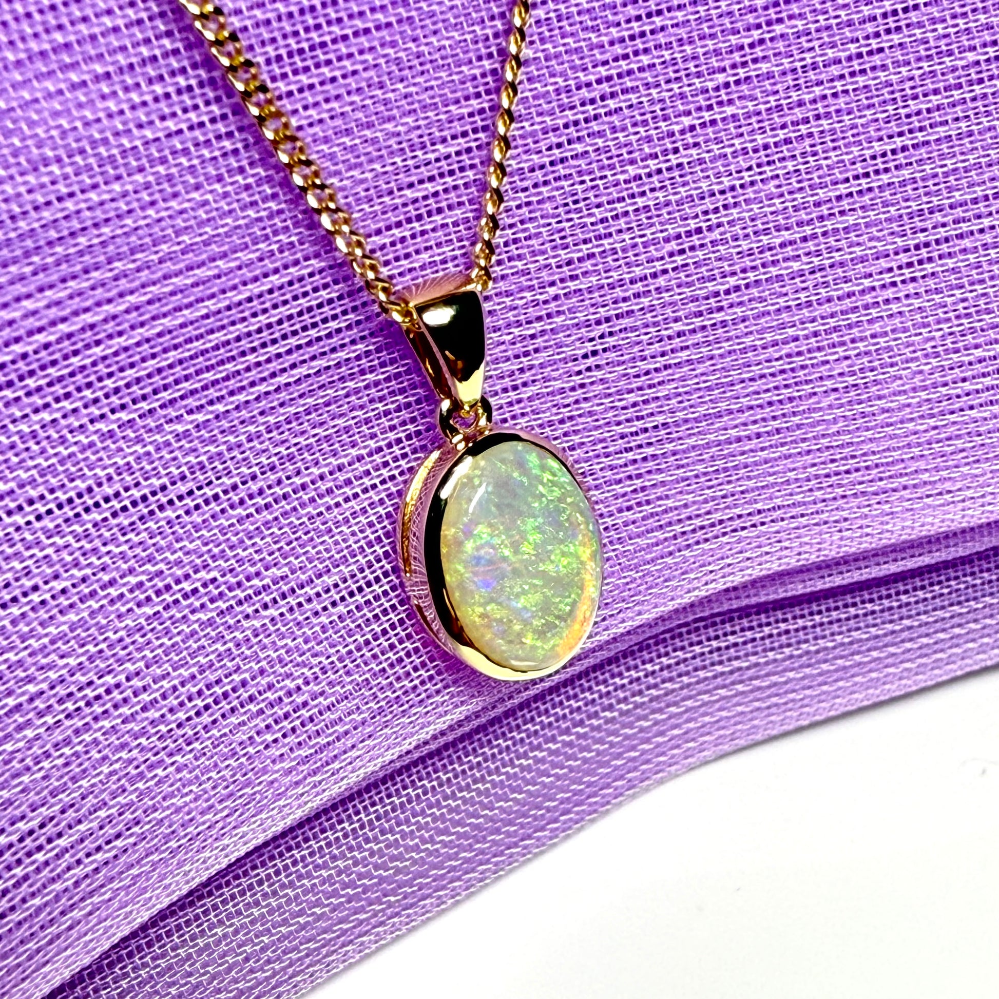 Real opal necklace yellow gold oval pendant smooth rubbed over setting