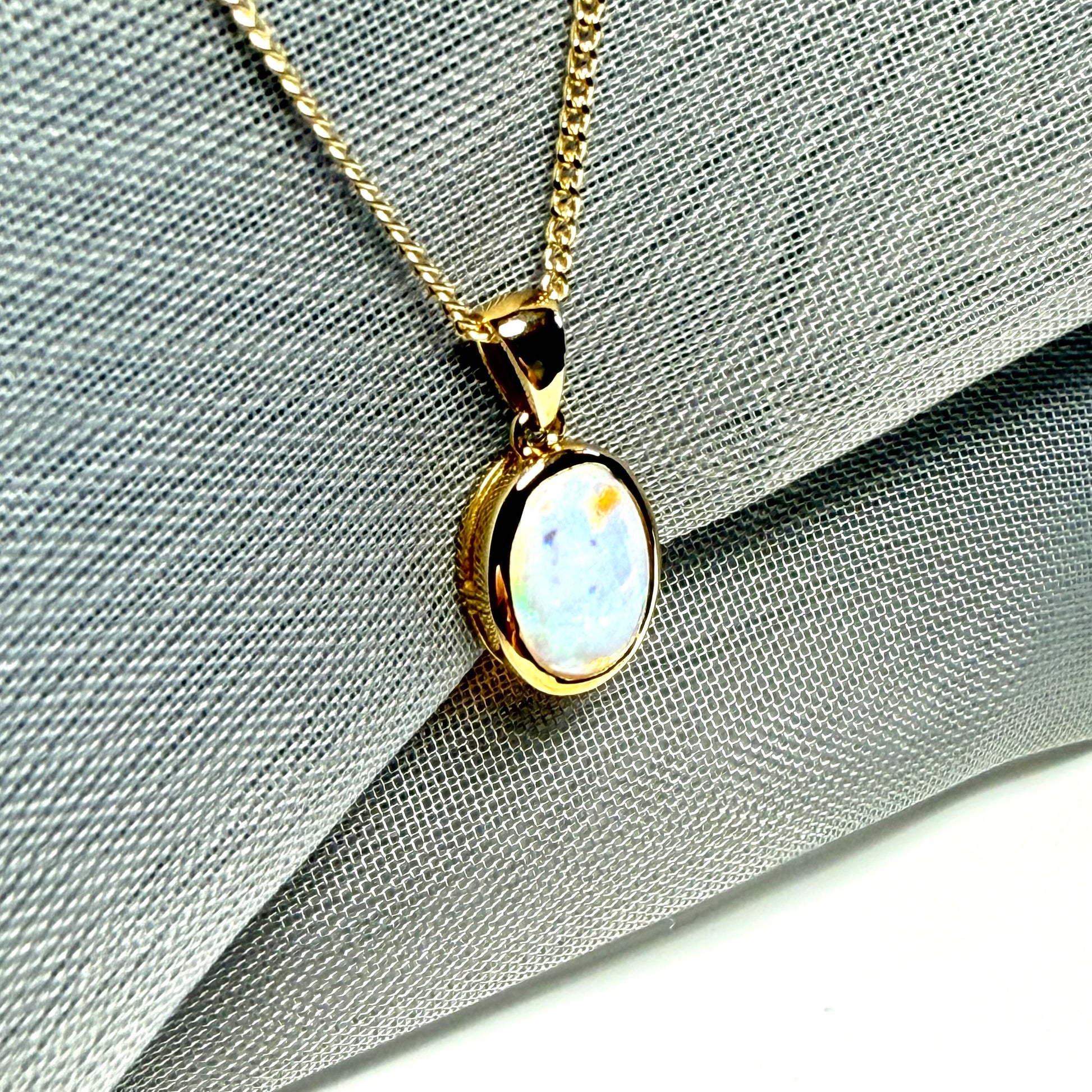 Real opal necklace yellow gold oval pendant smooth rubbed over smooth setting