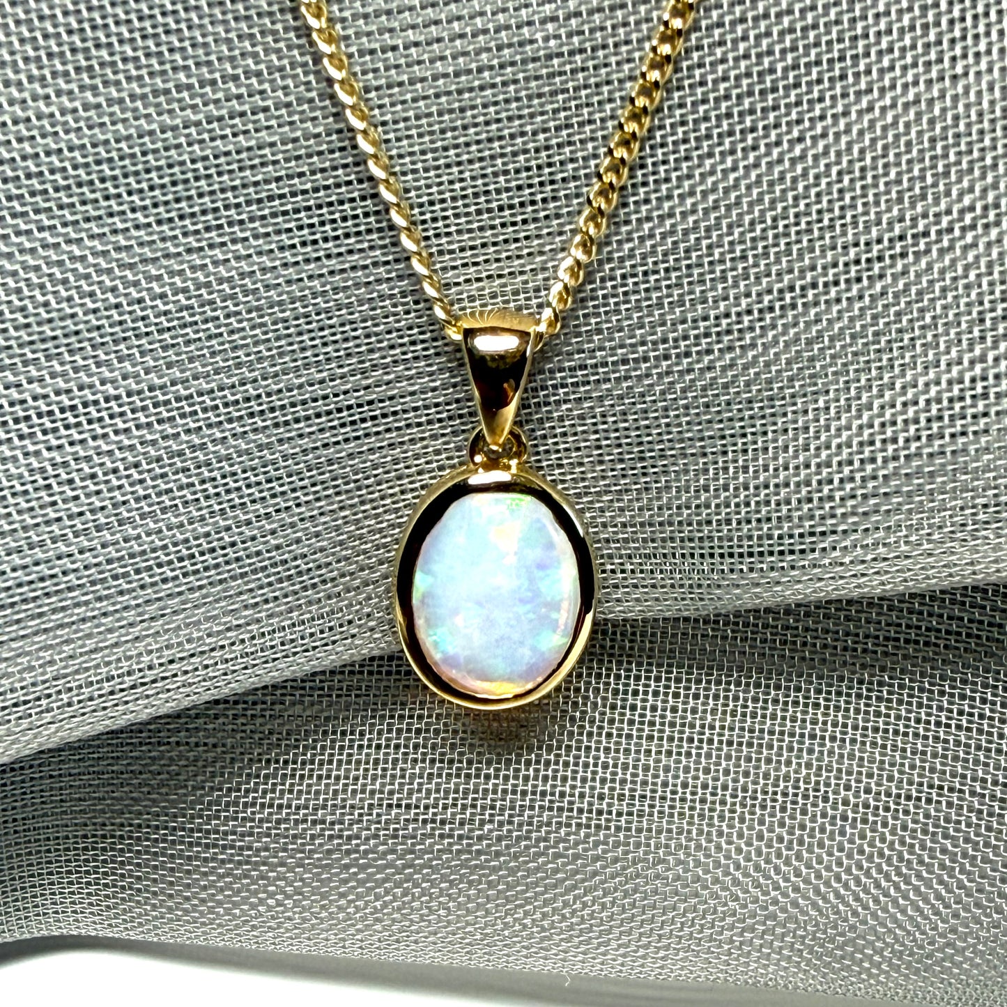 Real opal necklace yellow gold oval pendant smooth rubbed over smooth setting