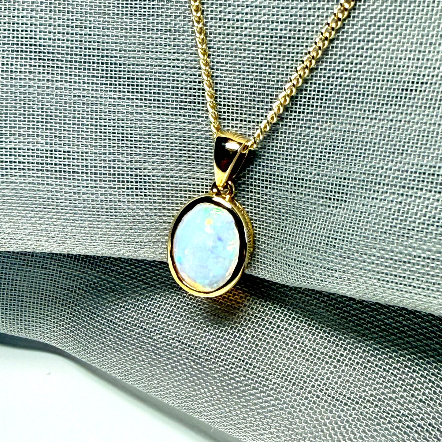 Real opal necklace yellow gold oval pendant smooth rubbed over smooth setting