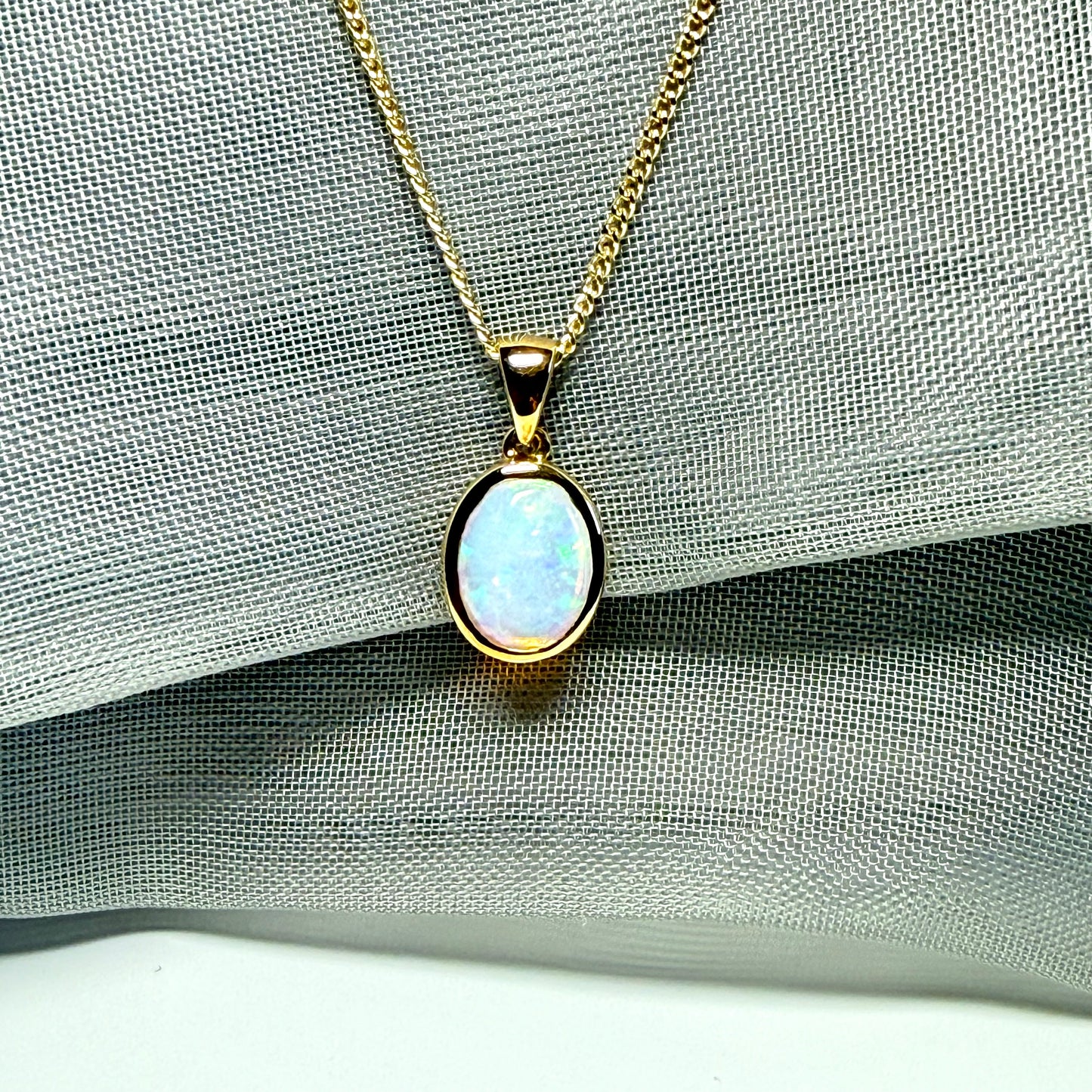 Real opal necklace yellow gold oval pendant smooth rubbed over smooth setting