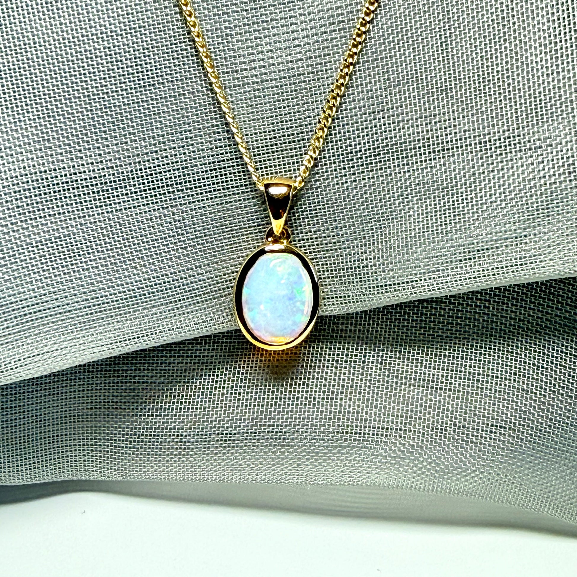 Real opal necklace yellow gold oval pendant smooth rubbed over smooth setting