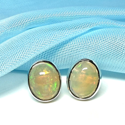 Real opal sterling silver oval shaped stud earrings