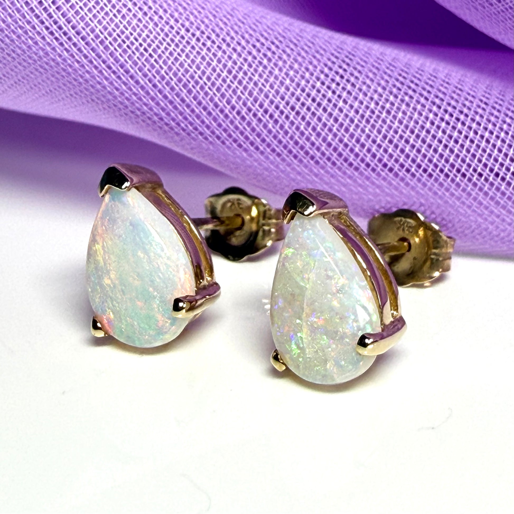 Real opal stud earrings Yellow gold claw setting with teardrop stones