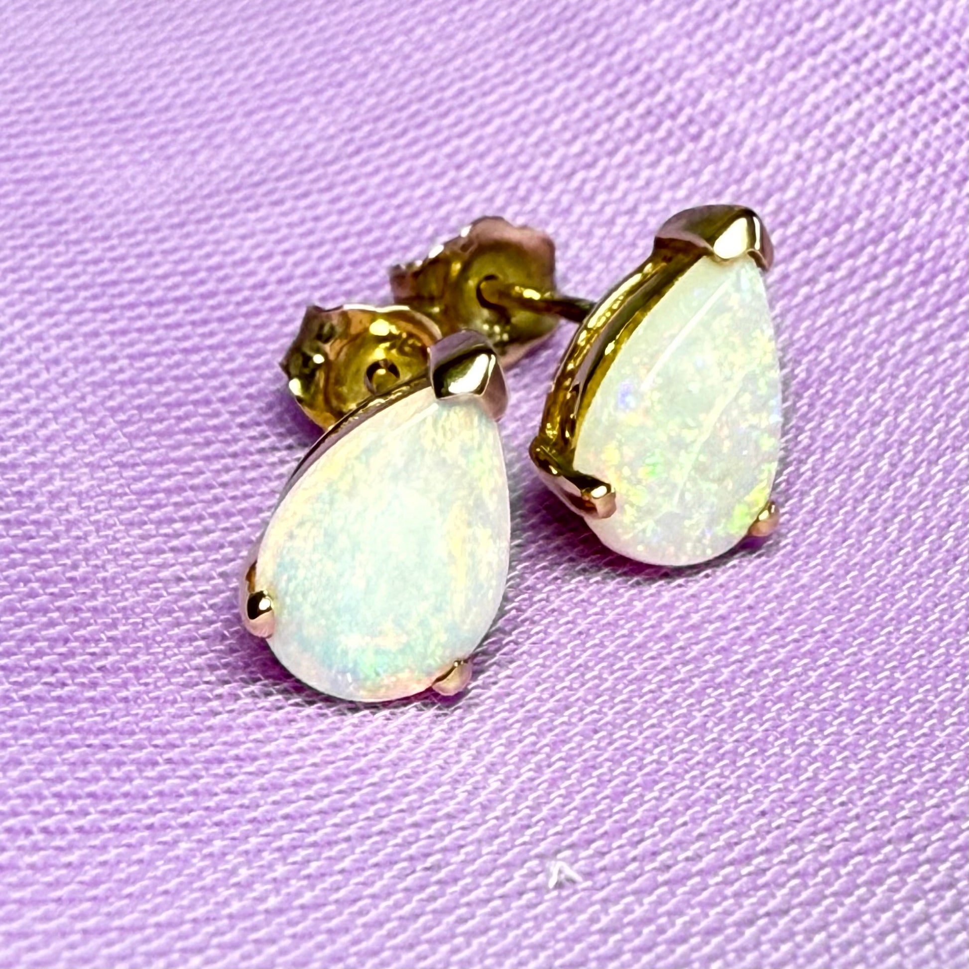 Real opal stud earrings Yellow gold claw setting with teardrop stones