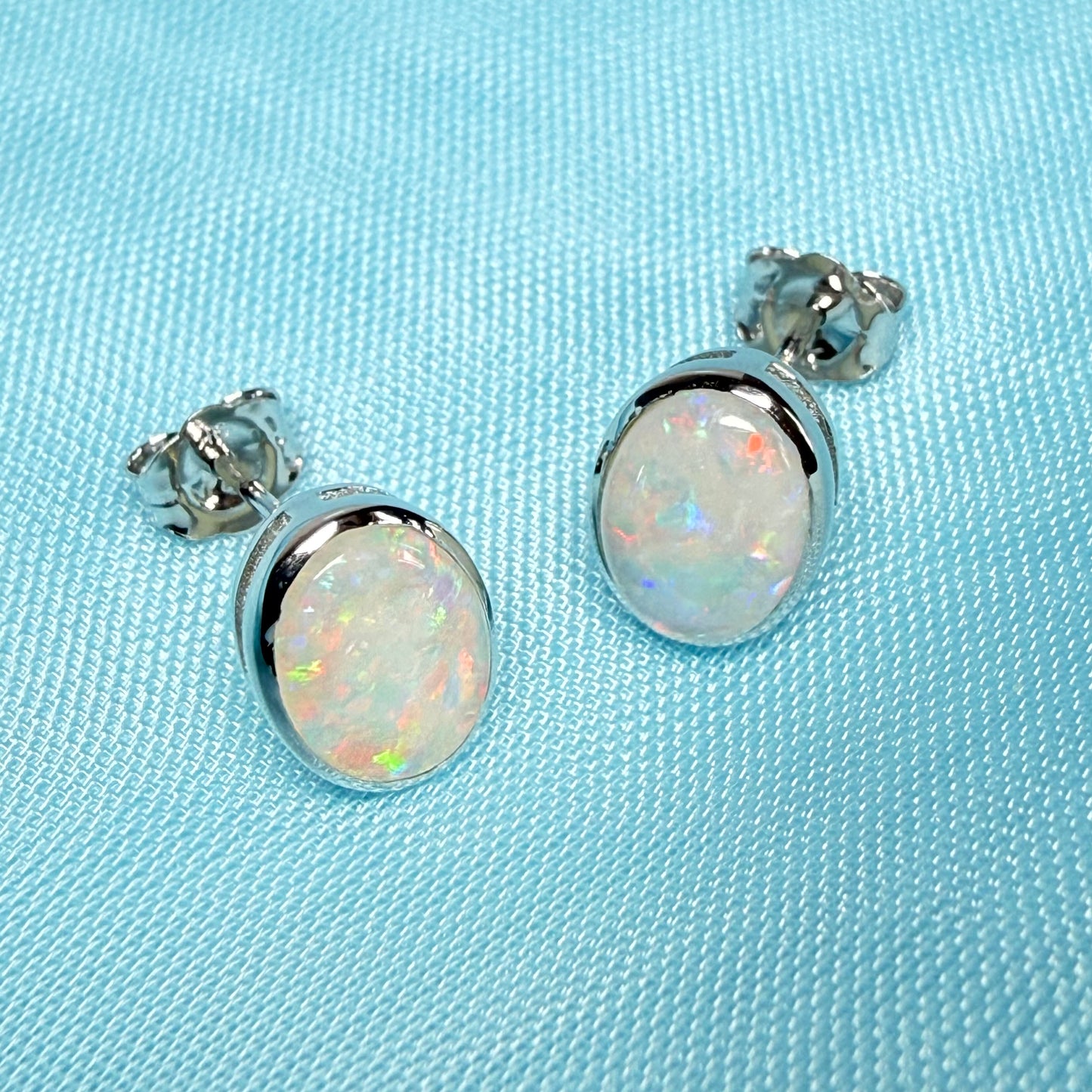 Pair of real opal white gold oval stud earrings