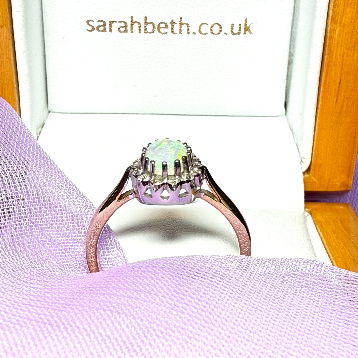 Real oval opal and diamond yellow gold cluster ring