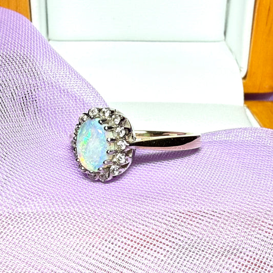 Real oval opal and diamond yellow gold cluster ring